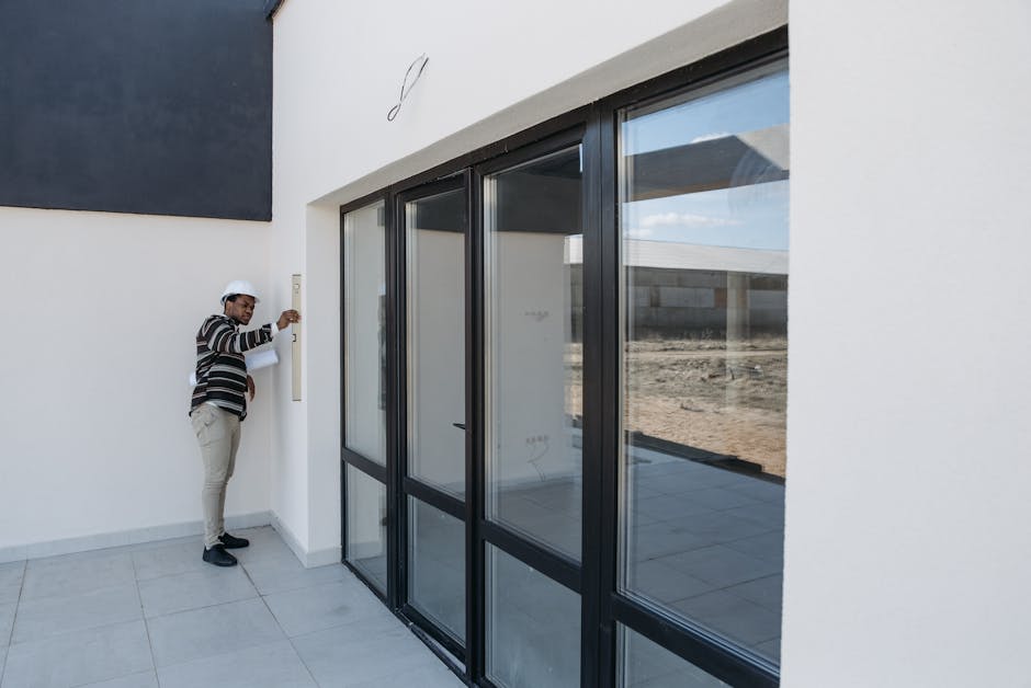 Contractor carefully installing a high-quality wooden door